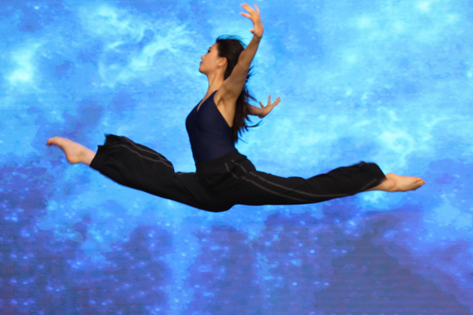 Dancer in a grand jeté at the Shining Hearts Gala